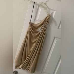Beautiful one shoulder gold sheen dress with circle bling at shoulder strap.